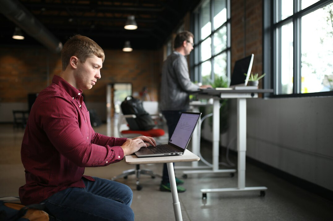 employee meditating in office